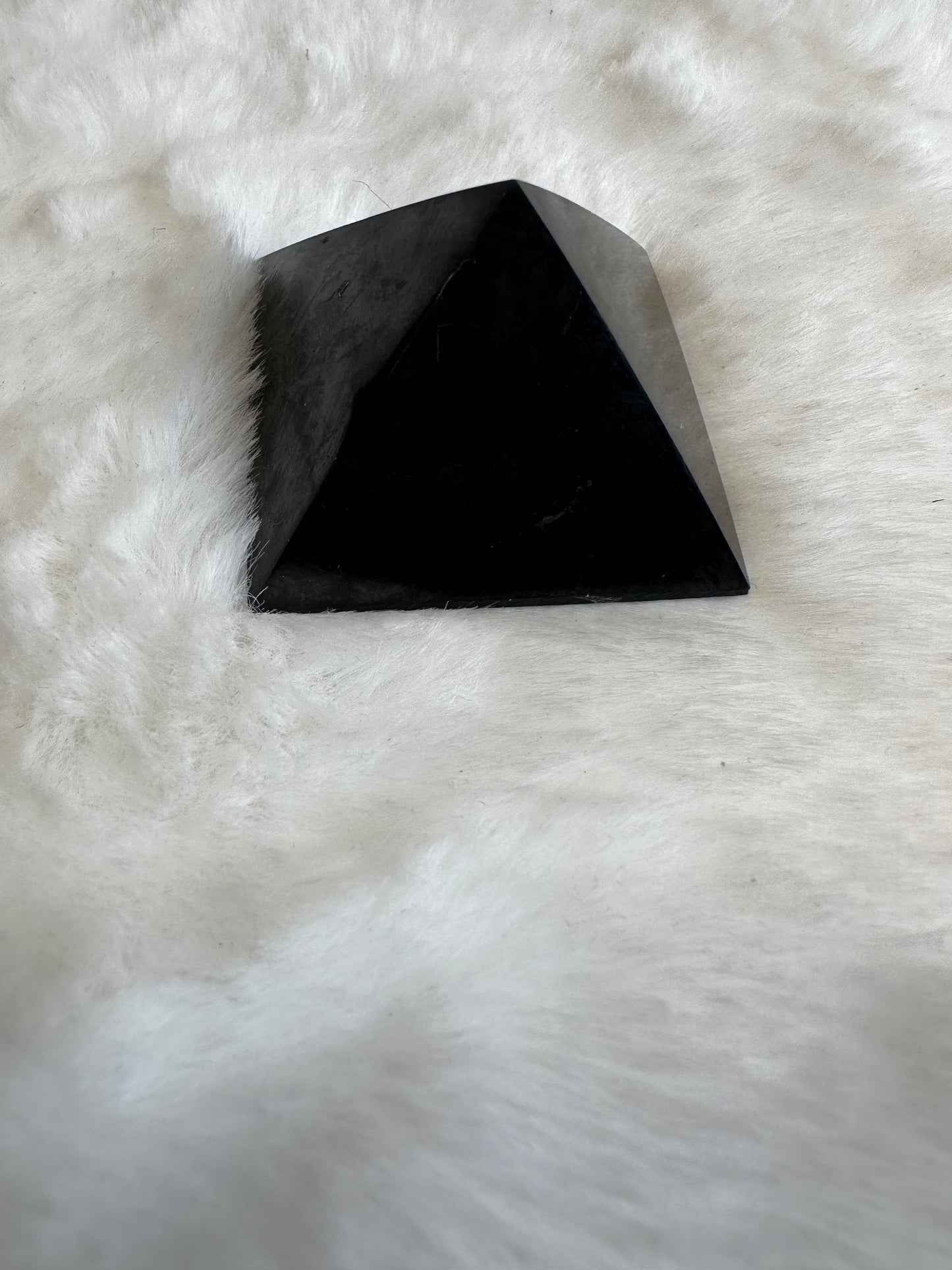 Small black obsidian pyramid