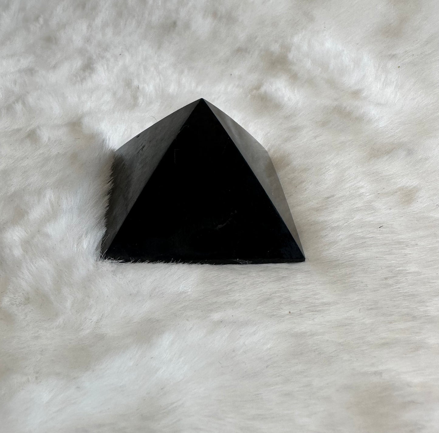 Small black obsidian pyramid