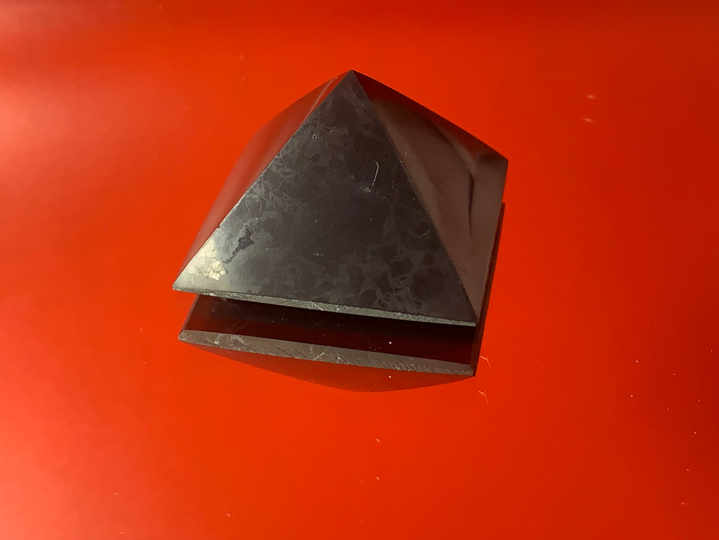 Small black obsidian pyramid